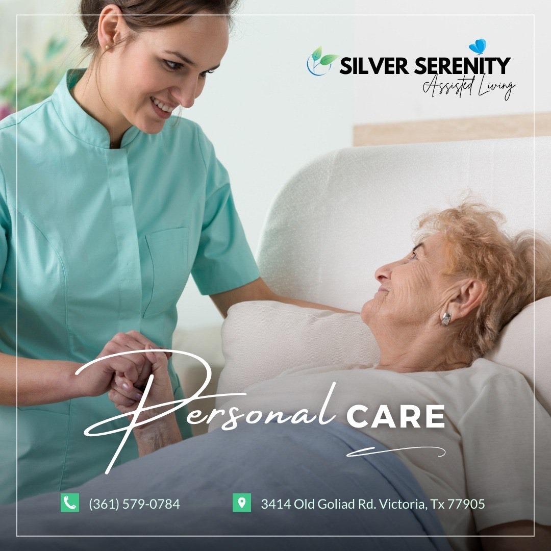 A caregiver helping a resident with a game at the table