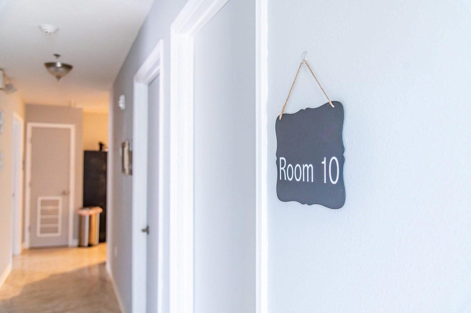 Hallway with a resident's room sign reading Room 10
